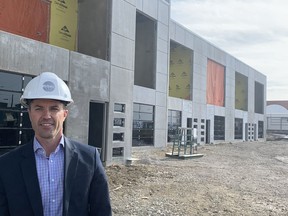 Sean Flathers, in leasing and development for Telsec, at the company’s under-construction commercial project on Manning Road N.E.