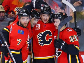 Calgary Flames Mikael Backlund celebrates with teammates after scoring a goal against the Arizona Coyotes during NHL hockey in Calgary on March 6, 2020.