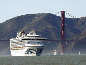 The Grand Princess cruise ship passes the Golden Gate Bridge as it arrives from Hawaii in San Francisco on Feb. 11, 2020. The ship is currently being tested for the coronavirus off the California coast. A Calgary woman is suspected to have contracted the virus while on board.