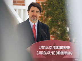 Canada's Prime Minister Justin Trudeau speaks to news media outside his home in Ottawa