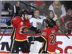 Milan Lucic (L) celebrates his second period goal with teammate Dillon Dube during NHL action between the Vegas Golden Knights and the Calgary Flames in Calgary Sunday March 8, 2020. Jim Wells/Postmedia