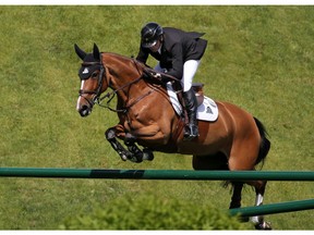 Canada's Eric Lamaze riding Fine Lady 5 competes in the CNOOC International Cup at the Spruce Meadows National on Sunday June 9, 2019. Gavin Young/Postmedia