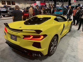 Atendees of the 2020 Calgary Auto and Truck Show admire a 2020 Corvette Stingray.