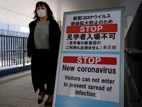 A bulletin board warns against entering the Toyosu fish market in Tokyo on March 5, 2020. The Calgary Board of Education has cancelled several overseas trips over fears of COVID-19.