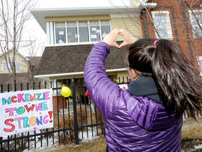 Family and residents rally outside the McKenzie Towne Long Term Care facility in Calgary on Tuesday, March 31, 2020.