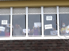 Family and residents rally outside the McKenzie Towne Long Term Care facility in Calgary on Tuesday, March 31, 2020.