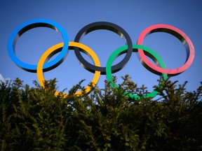 The Olympic Rings are pictured next to the headquarters of the International Olympic Committee (IOC) in Lausanne on March 21, 2020, as doubts increase over whether Tokyo can safely host the summer Games amid the spread of the COVID-19.