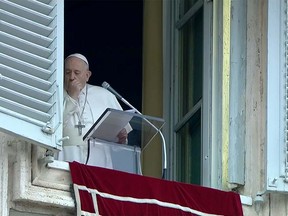 Pope Francis coughs as he leads the weekly Angelus prayer in St Peter's Square at the Vatican, March 1, 2020. Vatican Media/Handout via REUTERS ORG XMIT: GDN-VAT151