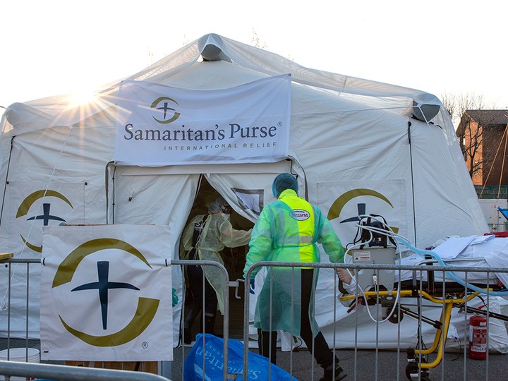  A patient is wheeled into the Samaritan’s Purse field hospital.