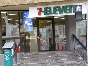 Workers from On Side Restoration clean a 7-Eleven at 435 4ave. S.W. after an employee had a presumptive case of COVID-19 in Calgary on Tuesday, March 24, 2020. Darren Makowichuk/Postmedia