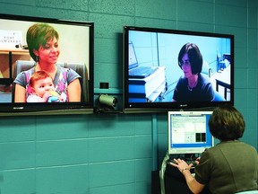 Kathy Pickford demonstrates the new audiology Telehealth program from Edmonton Wednesday, May 5, 2011. Leila Mazaheri and her seven-month-old daughter Eilya Leask were the first in Fort McMurray to use the program.