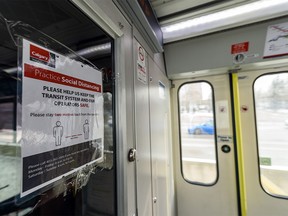 Pictured is a Calgary Transit sign inside a CTrain car advising passengers to practice social distancing on Thursday, April 2, 2020.