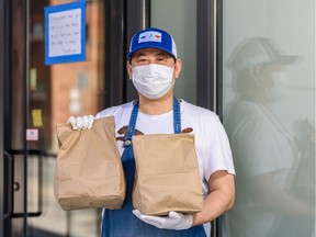 Roy Oh who has recently started a new Korean take-out business cooking out of Melo Eatery poses for a photo on Thursday, April 9, 2020. Azin Ghaffari/Postmedia