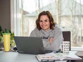 Junior high school teacher Maurae Woitas poses for a photo at the office she has set up at her kitchen on Thursday, April 9, 2020. Azin Ghaffari/Postmedia