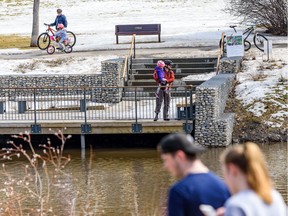 People spend the afternoon in Confederation Park on Friday, April 17, 2020. Experts are weighing in on what the road back to "normal" looks like, and when we could see the end of social distancing measures.