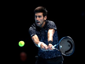 Novak Djokovic of Serbia plays a backhand during his singles final against Alexander Zverev of Germany during Day Eight of the Nitto ATP Finals at The O2 Arena on November 18, 2018 in London, England.