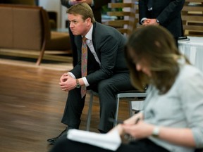 Minister of Health Tyler Shandro watches Premier Jason Kenney discuss the Province's COVID-19 modelling during a press conference, in Edmonton Wednesday April 8, 2020.