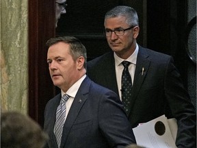 Jason Kenney, left, with Finance Minister Travis Toews, has joined a long list of free-spending premiers in Alberta. That chaos has to stop with a financial reset, says columnist Danielle Smith.