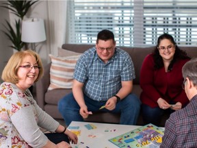 Mike Hopkins and Melanie Boudreau, centre, with Melanie's parents Nicole and James Boudreau. The two couples each bought a home at the Urban Terraces by Avi Urban in Carrington.