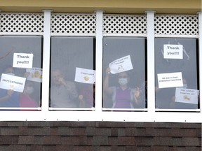 Family and residents rally outside the McKenzie Towne Long Term Care facility in Calgary on Tuesday, March 31, 2020. Darren Makowichuk/Postmedia