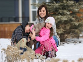 Christy Berrington with her children Carter, 8, and Charlotte, 6, and their dog Fletcher.