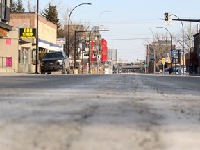 Few vehicles are seen on 9th Ave. SE at 5:30 PM Saturday. Normally Inglewood would be full of shoppers, cars and active. Now Calgary, along with many countries around the world, adjust to the new normal created by the COVID-19 pandemic. Saturday, April 4, 2020. Brendan Miller/Postmedia