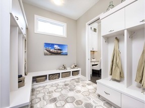 The mudroom, with ample lockers and stylish hexagon tiling in the Homes By Avi's Waterford show home in Artesia.