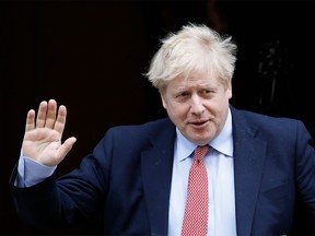 (FILES) In this file photo taken on March 25, 2020 Britain's Prime Minister Boris Johnson leaves number 10 Downing Street in central London on March 18, 2020, on his way to the House of Commons to attend Prime Minister's Questions (PMQs) - British Prime Minister Boris Johnson was taken to hospital on April 5, 2020 for tests, his office said, 10 days after he tested positive for coronavirus. Johnson, 55, announced he had mild symptoms of COVID-19 on March 27 and had been in self-isolation at his Downing Street residence for seven days. (Photo by Tolga AKMEN / AFP) (Photo by TOLGA AKMEN/AFP via Getty Images)