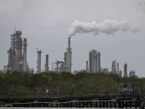 In this file photo, a refinery near the Corpus Christi Ship Channel is seen on March 11, 2019, in Corpus Christi, Texas. The US benchmark WTI crude oil price collapsed on April 20. 2020h, falling to -$37.63/barrel amid an epic supply glut caused largely by the coronavirus pandemic's hit to demand.