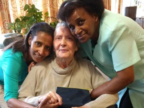 Nura (left) and Melva  (right), angelic staff at the Arbutus Care Centre in Vancouver, hug Pilar Corbella in 2018, just months before she passed away.