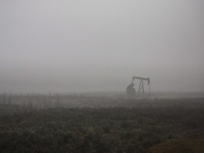 A pumpjack works at a well head on an oil and gas installation on a foggy day near Cremona, Alta., Saturday, Oct. 29, 2016. Canada's oil producers could only sit and watch as the price of their product plummeted to less than what it costs to buy a litre of soda in March, hit by the combined whammy of a COVID-19-induced drop in global demand, and a production war between Russia and Saudi Arabia that flooded the market with more oil it didn't need.
