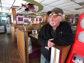 Blackfoot Diner owner Terry Taylor poses in the empty restaurant in Calgary Tuesday, March 31, 2020. Jim Wells/Postmedia