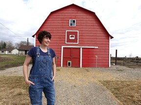 Christina Stender pauses in front of one of the barns at Eh Farms near Strathmore, Ab, east of Calgary on Thursday, April 30, 2020. The family raises Mangalitsa pigs as well as chickens, and geese. Jim Wells/Postmedia