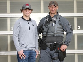 Calgary police tactical team member Sgt. Jim Smolinski and his son Ethan in Calgary on Thursday, April 23, 2020.