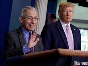 National Institute of Allergy and Infectious Diseases director Dr. Anthony Fauci speaks as U.S. President Donald Trump listens during the coronavirus response daily briefing at the White House in Washington on April 10, 2020.
