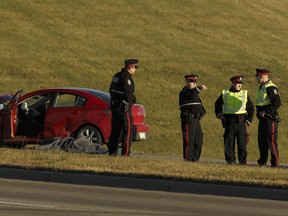 Edmonton Police Service officers investigate a fatal collision at 184 Street near Anthony Henday Drive in Edmonton in 2017. Columnist argues the provincial government should reject calls for no-fault motor vehicle insurance.
