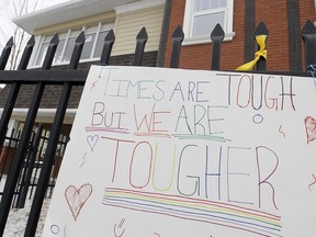 A sign of support hangs from a fence outside the McKenzie Towne Continuing Care Centre on Friday, April 3, 2020. A COVID-19 outbreak at the facility has killed eight residents, including four announced on Friday.