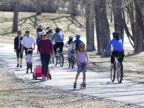 As temperatures warm up pathways are getting busy like Confederation Park making social distancing harder in Calgary on Monday, April 20, 2020. Darren Makowichuk/Postmedia