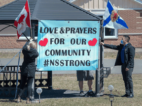 Workers at an extended care facility show their community support in Debert, N.S., on April 21, 2020 for victims of the Nova Scotia mass shootings.