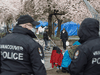 Vancouver Police officers patrol at Oppenheimer Park in Vancouver’s downtown eastside, March 26, 2020.