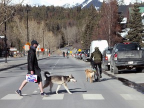 Normally bustling Banff Avenue is quiet on a Sunday evening in April.