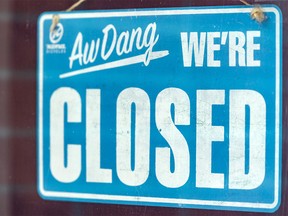Pictured is a closed sign seen at a Bridgeland business on Wednesday, May 13, 2020.