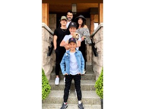 The Hope family -- Tyler, Carmella, Jaguar, Hudson and Bentley -- took a porch portrait at their home in Watermark at Bearspaw to support the Calgary Food Bank.