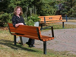 Shauna Caldwell sits at two benches, near her home, placed in memory of her twin sons, Evan and Jordan Caldwell, who were killed in an accident at Canada Olympic Park in 2016.  Gavin Young/Postmedia