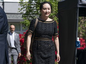 VANCOUVER, BC - MAY 27: Meng Wanzhou, CFO of Huawei, walks down her driveway to her car as she departs her home for the B.C. Supreme Court on May 27, 2020 in Vancouver, Canada.