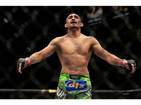LAS VEGAS, NV - DECEMBER 06:  Tony Ferguson celebrates after defeating Abel Trujillo in their fight during the UFC 181 event at the Mandalay Bay Events Center on December 6, 2014 in Las Vegas, Nevada.