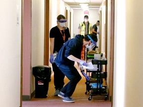 Nurses deliver medicine to individiual rooms on the second floor at the assisted self isolation hotel in Calgary on Thursday, May 7, 2020. Postmedia has agreed not to reveal the exact location of the hotel.