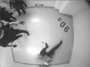 CCTV stills showing Jurgen Kaasa being handcuffed to a "restraint device" in a cell at Edmonton police headquarters. Kaasa, who was arrested for being unruly and intoxicated at a local book store, was restrained in this position for over three hours.