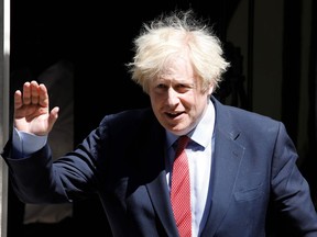 Britain's Prime Minister Boris Johnson leaves 10 Downing Street in central London on May 20, 2020 to attend Prime Minister's Questions (PMQs) in the Houses of Parliament.