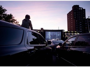 File photo: People in their cars attend a popup drive-in movie night at Bel Air Diner on May 20, 2020 in Queens, New York City.